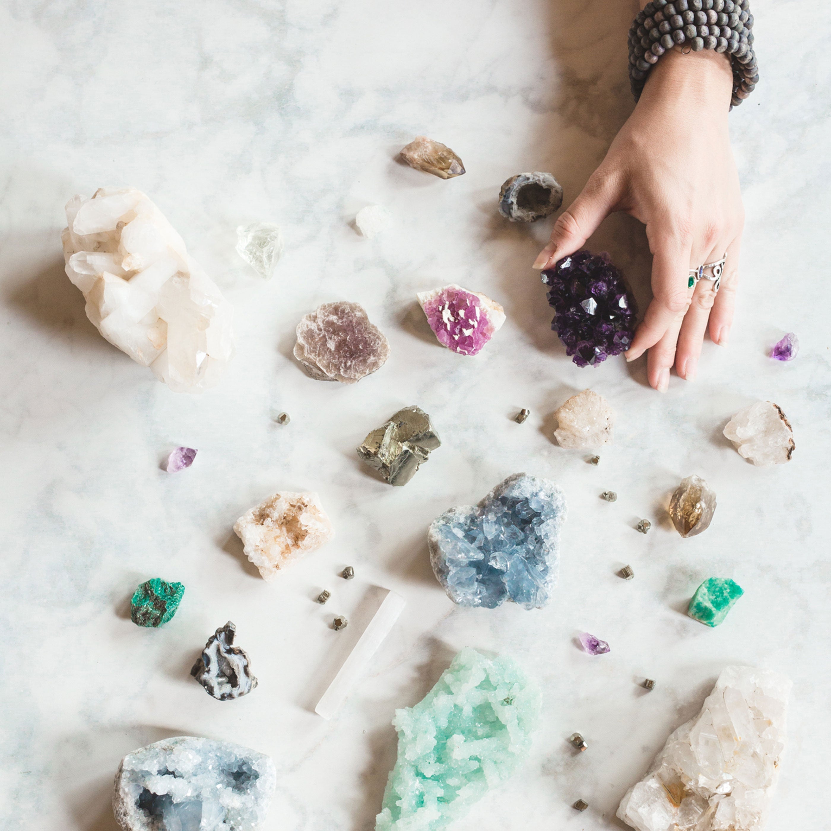 crystals for new beginnings featuring amethyst, clear quartz, and healing stones