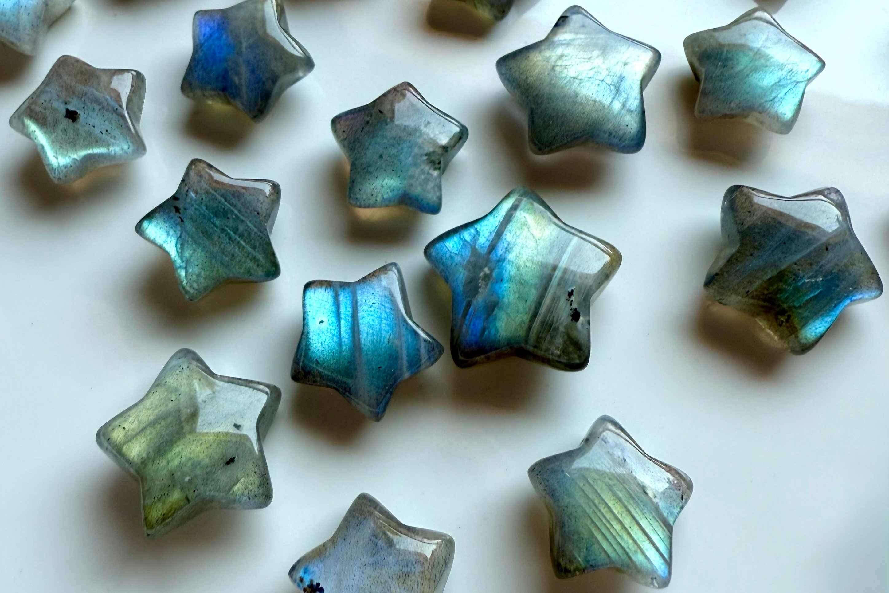 Flashy Labradorite crystal stars with blue, teal, and green hues — celestial carvings for intuition, third eye chakra healing, and spiritual connection.