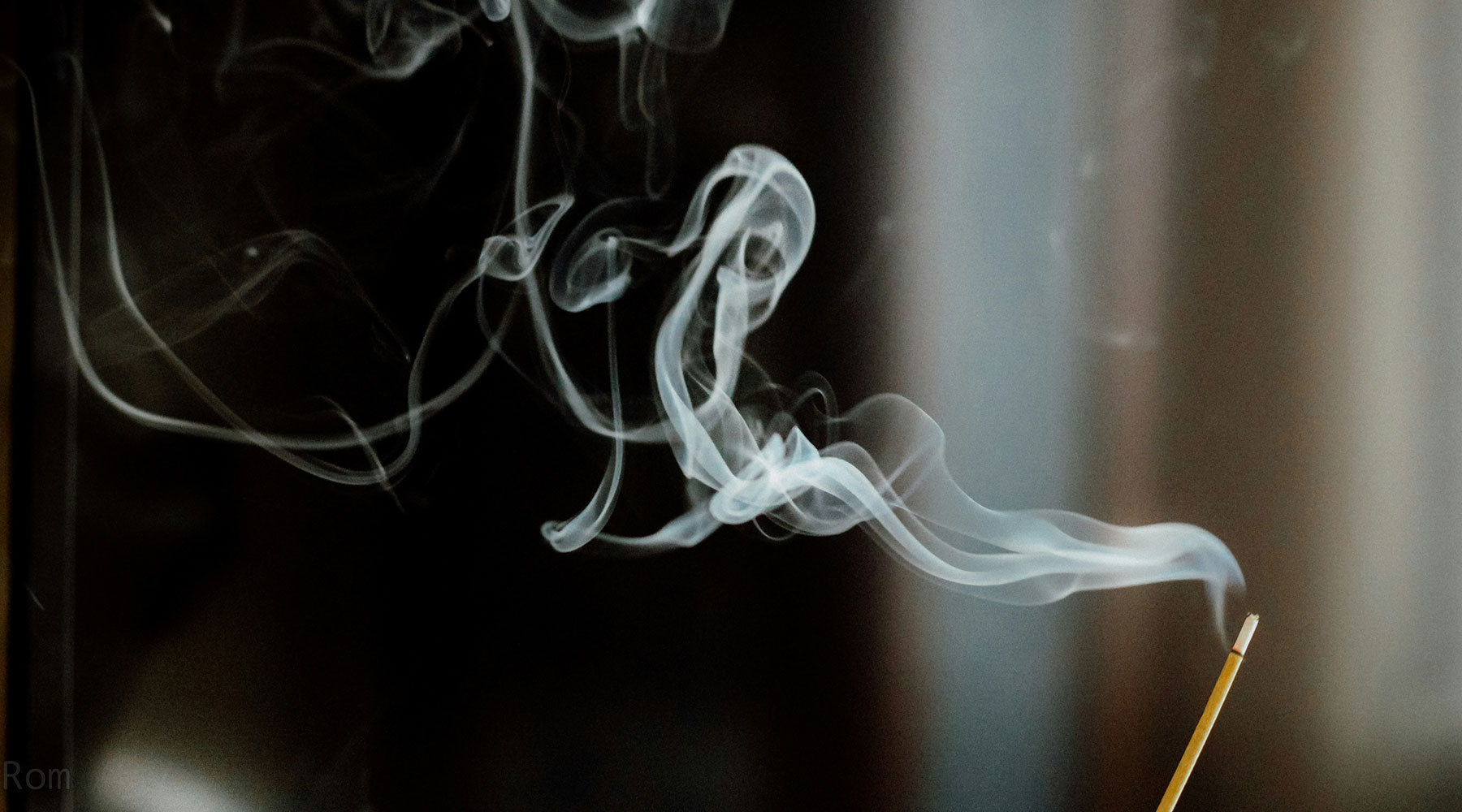Incense smoke wafting in dark background — sacred smoke ritual for cleansing, purification & spiritual clarity.