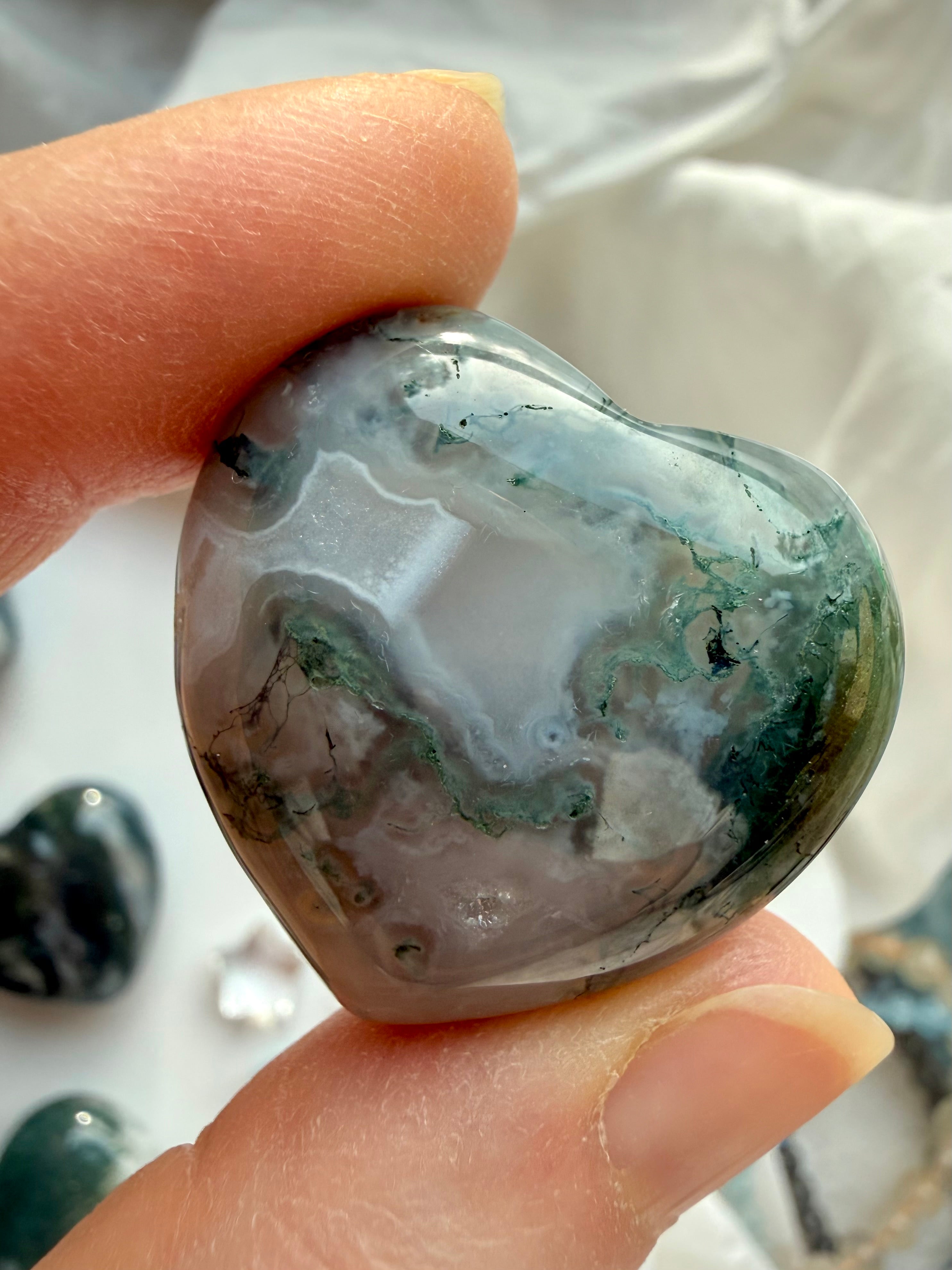 Translucent Moss Agate heart with delicate moss formations and smoky white quartz tones