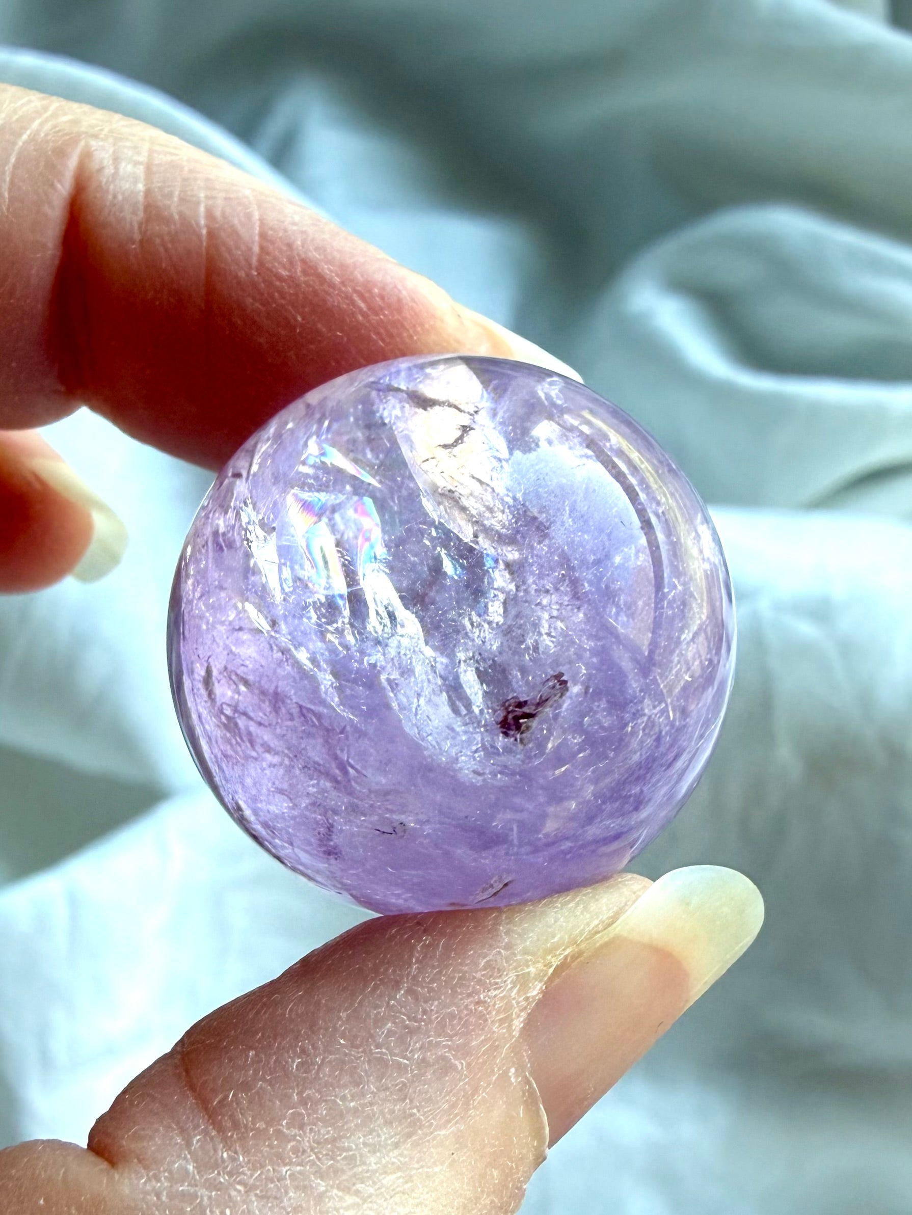 smoky amethyst mini sphere with natural inclusions and polished surface