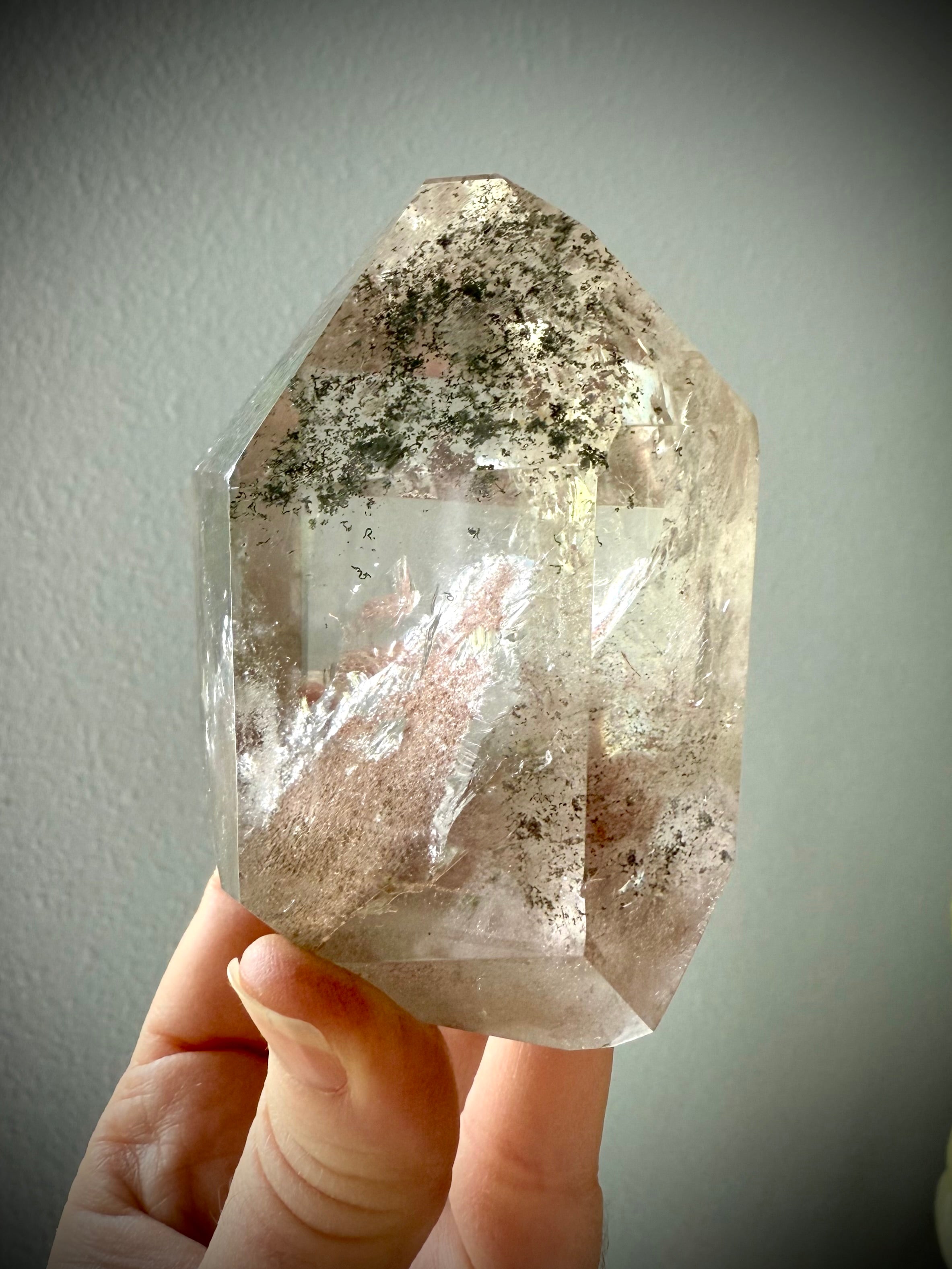 This Lodolite Garden Quartz Tower has a big reddish orange pyramid phantom, plus lots rainbows