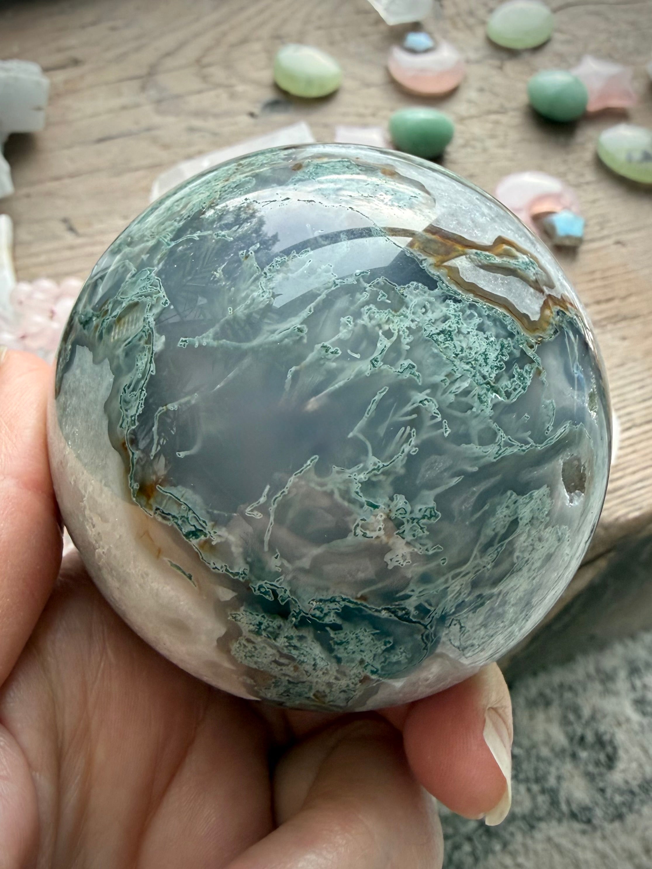 One of a kind Moss Agate crystal sphere with unique green, white, and gray chalcedony formations