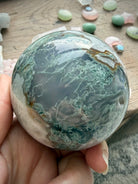 One of a kind Moss Agate crystal sphere with unique green, white, and gray chalcedony formations