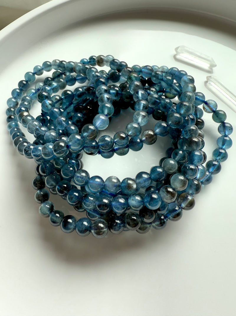 Deep blue Aquamarine Bracelets aka Devil Aquamarine photographed in natural light on a white plate