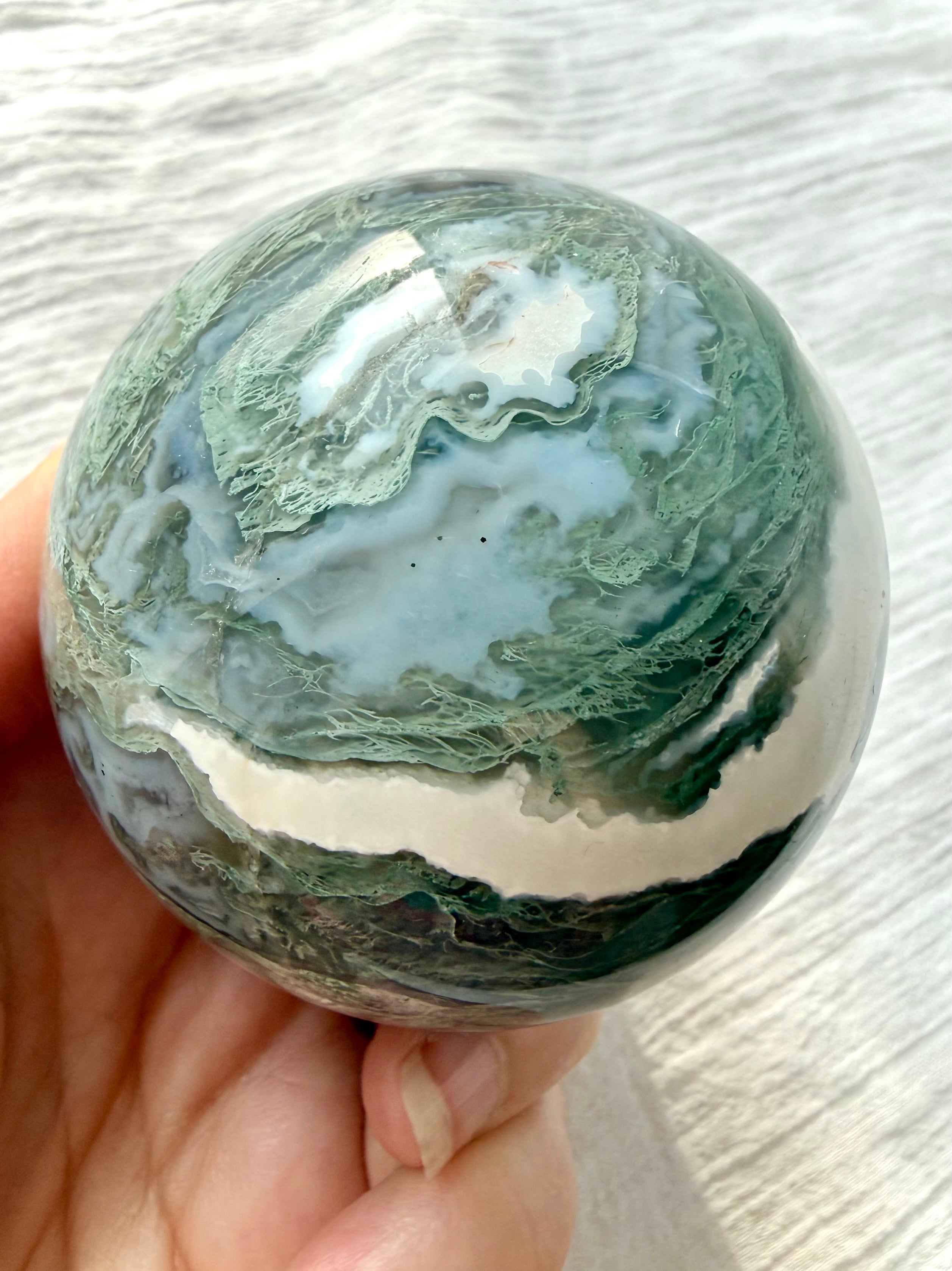 Moss Agate sphere with lacy mint green dendrites, blue gray chalcedony and white agate banding