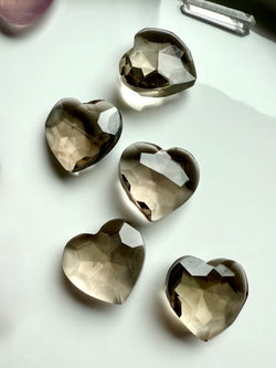 Our Smokey Quartz Hearts have a grounding energy that relieves stress + balances the Root Chakra