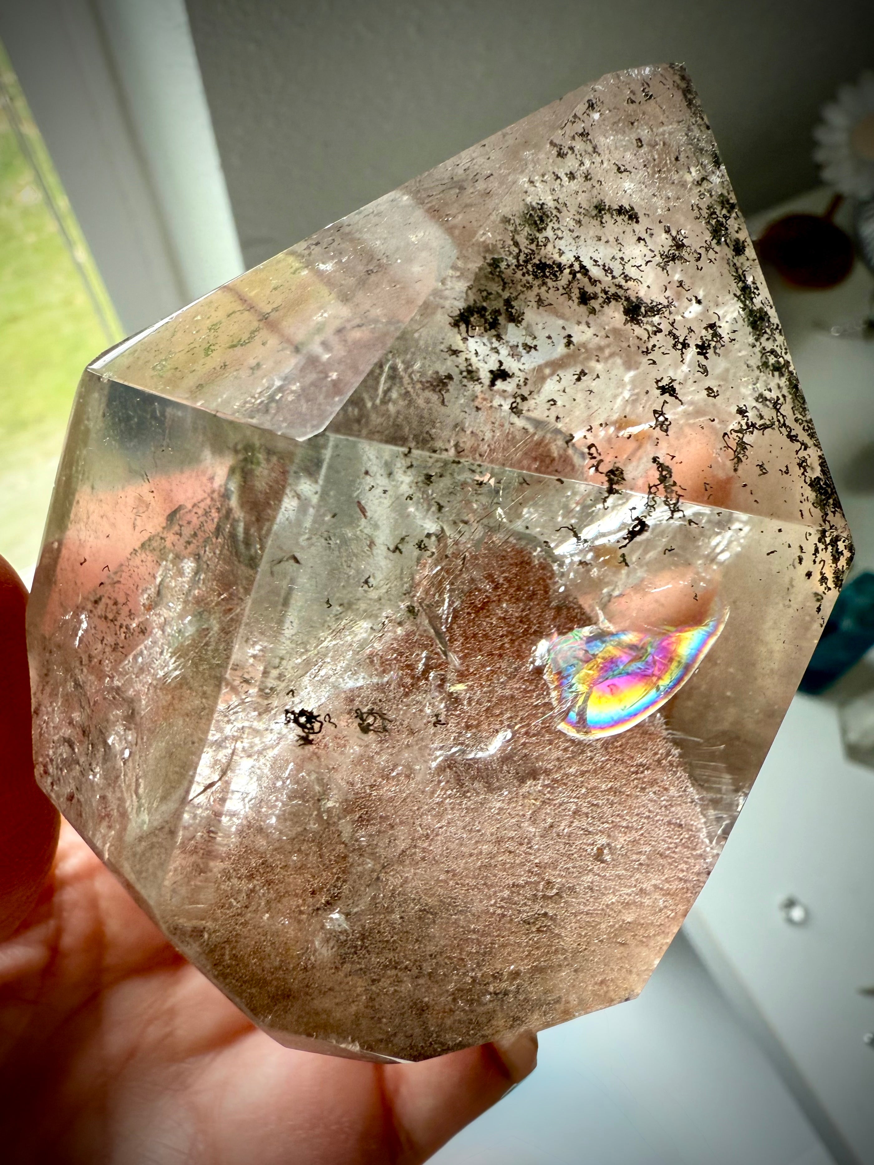 This Lodolite Garden Quartz Tower has a big reddish orange pyramid phantom, plus lots rainbows