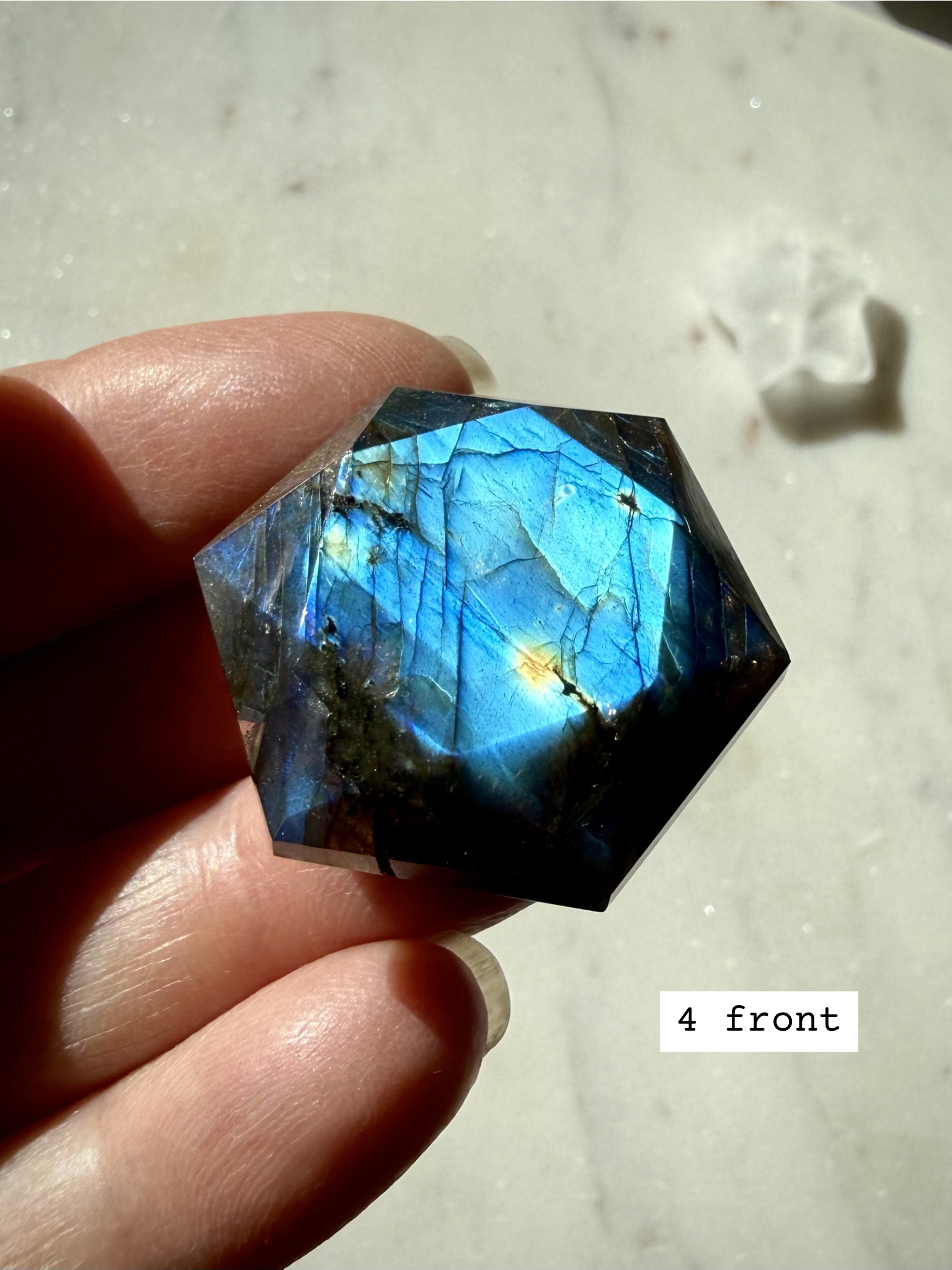 Faceted Labradorite hexagon with blue flash – sacred geometry crystal for Third Eye Chakra, front view