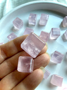 Natural rose quartz cube crystals from Mozambique with soft pink tones and beveled edges
