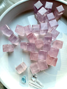 Rose quartz mini cube crystals from Mozambique with soft pink tones and beveled edges, sacred geometry heart chakra stones