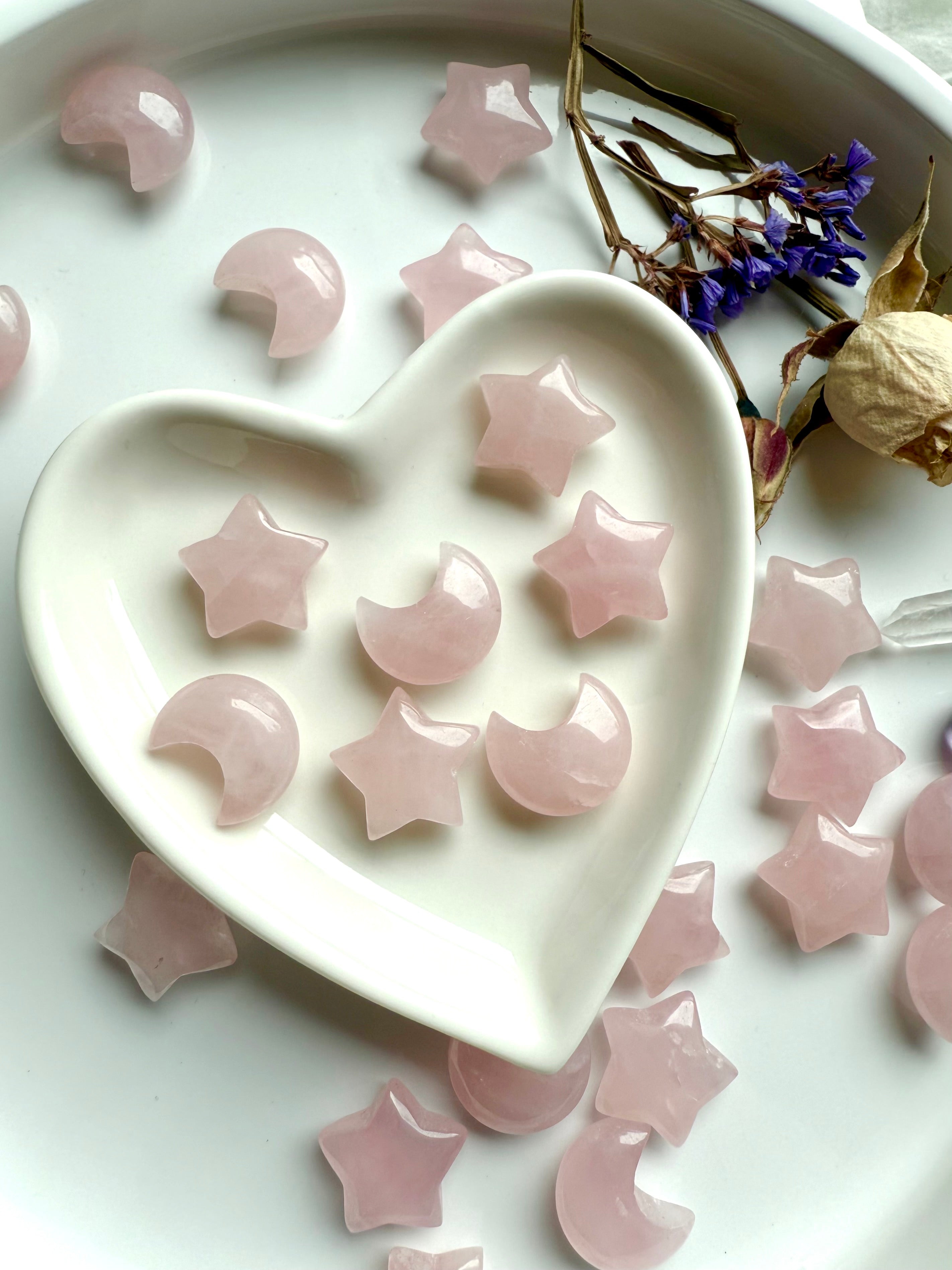 Rose Quartz moons and stars in a white heart bowl. Mini crystal carvings for love, peace & Heart Chakra healing energy.
