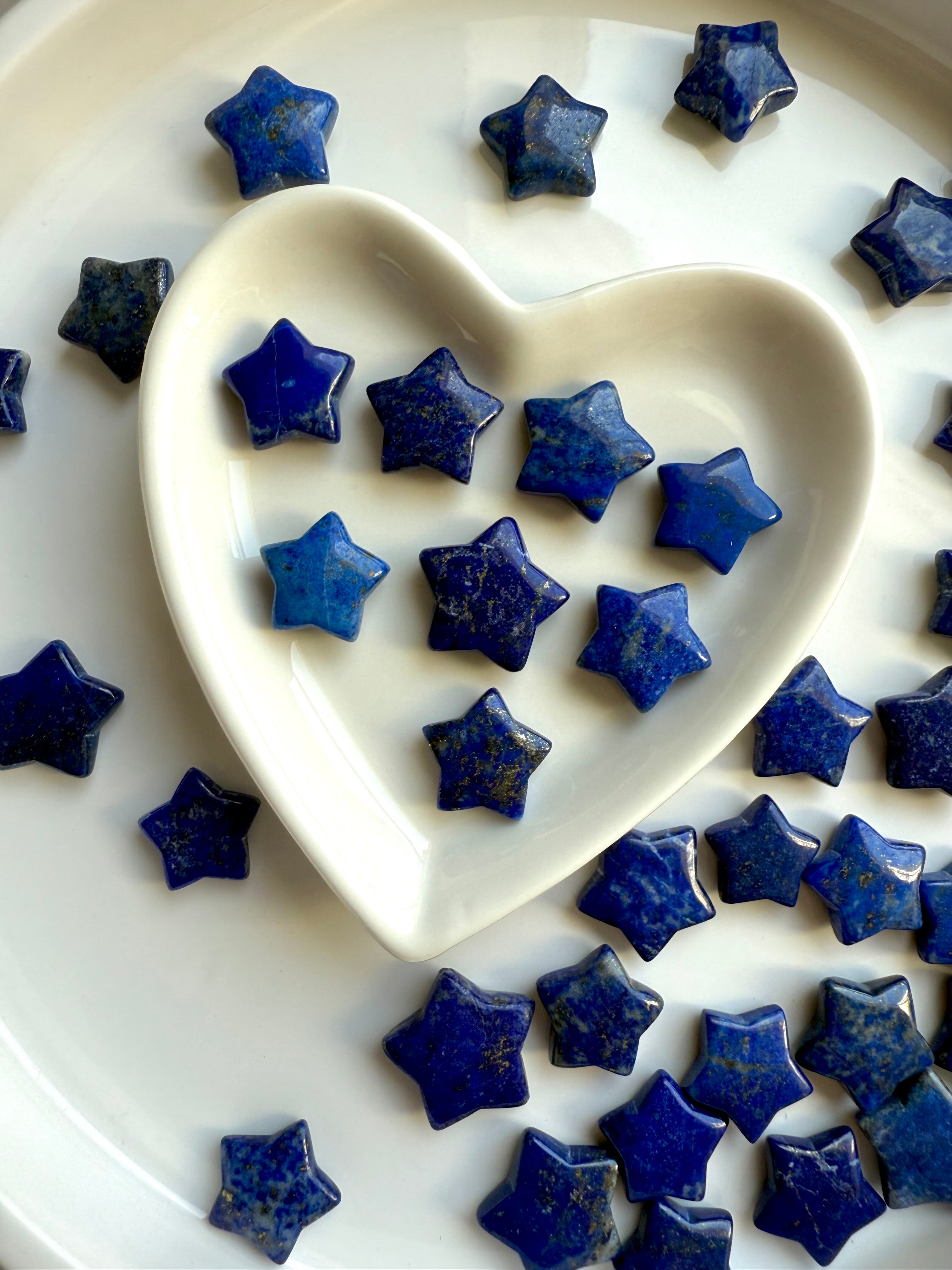 Assorted Lapis Lazuli star carvings showing size and color variation