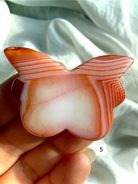 Carnelian Butterfly crystal carving number 5 with warm red and peach tones