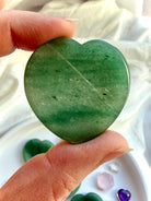 back view of green aventurine heart worry stone with natural mineral inclusions and smooth polished finish