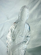 Close up of Collector-quality Quan Yin carving in natural Clear Quartz with graceful lines and peaceful expression