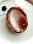 carnelian gemstone bowl with white quartz center used as ring dish and crystal display