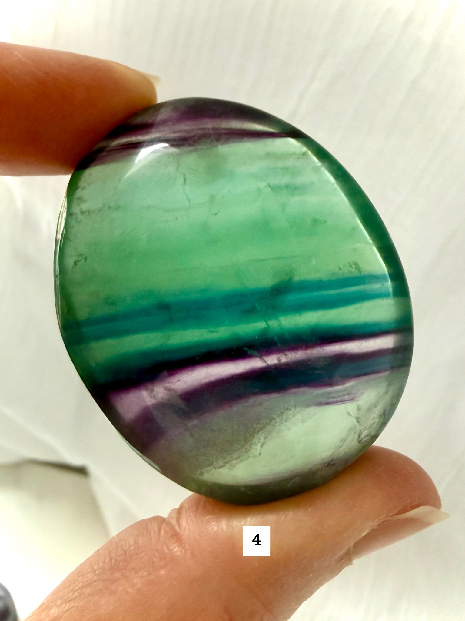 Rainbow Fluorite Palm Stone #4 with bold teal, green and purple geometric banding