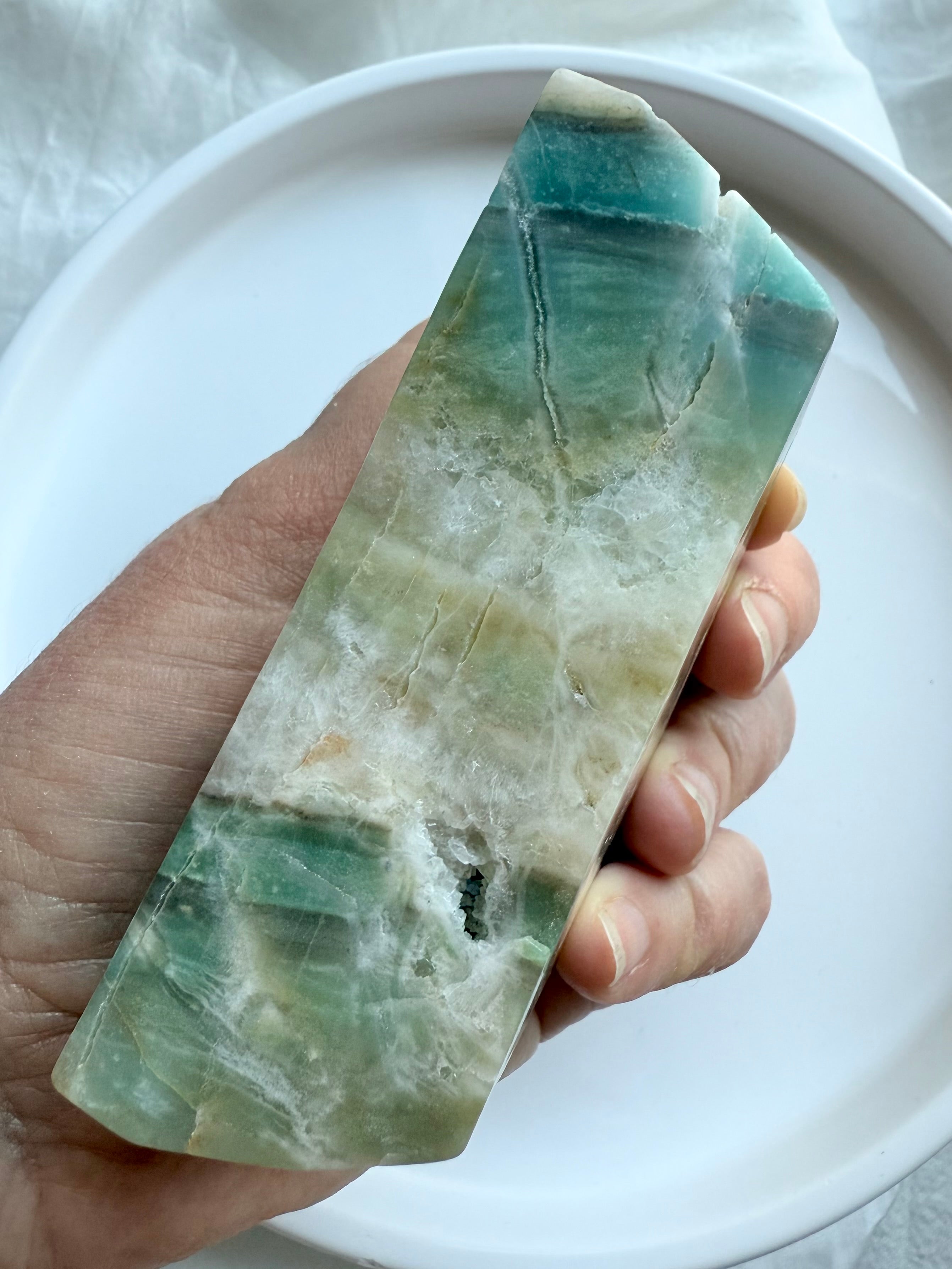 Sky Blue Quartz crescent moon bowl side view held in hand