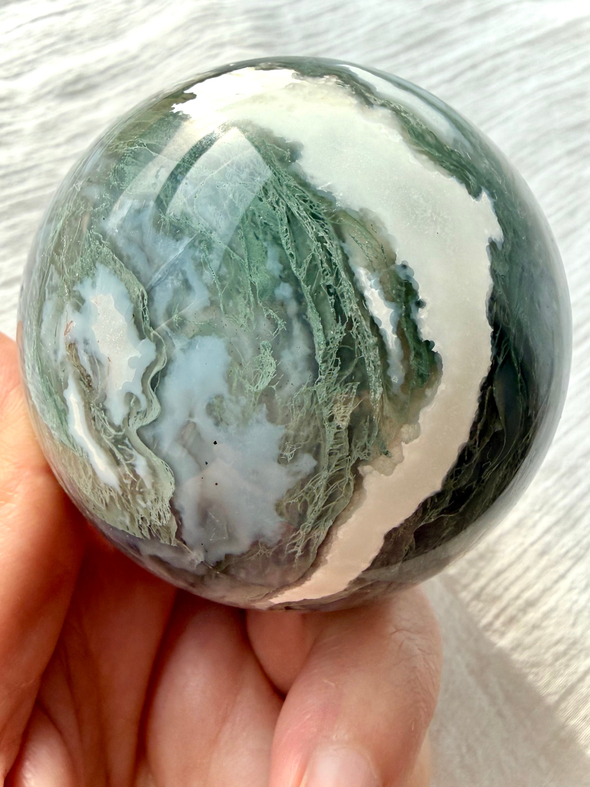 Polished Moss Agate crystal sphere with pale green dendritic inclusions and white agate