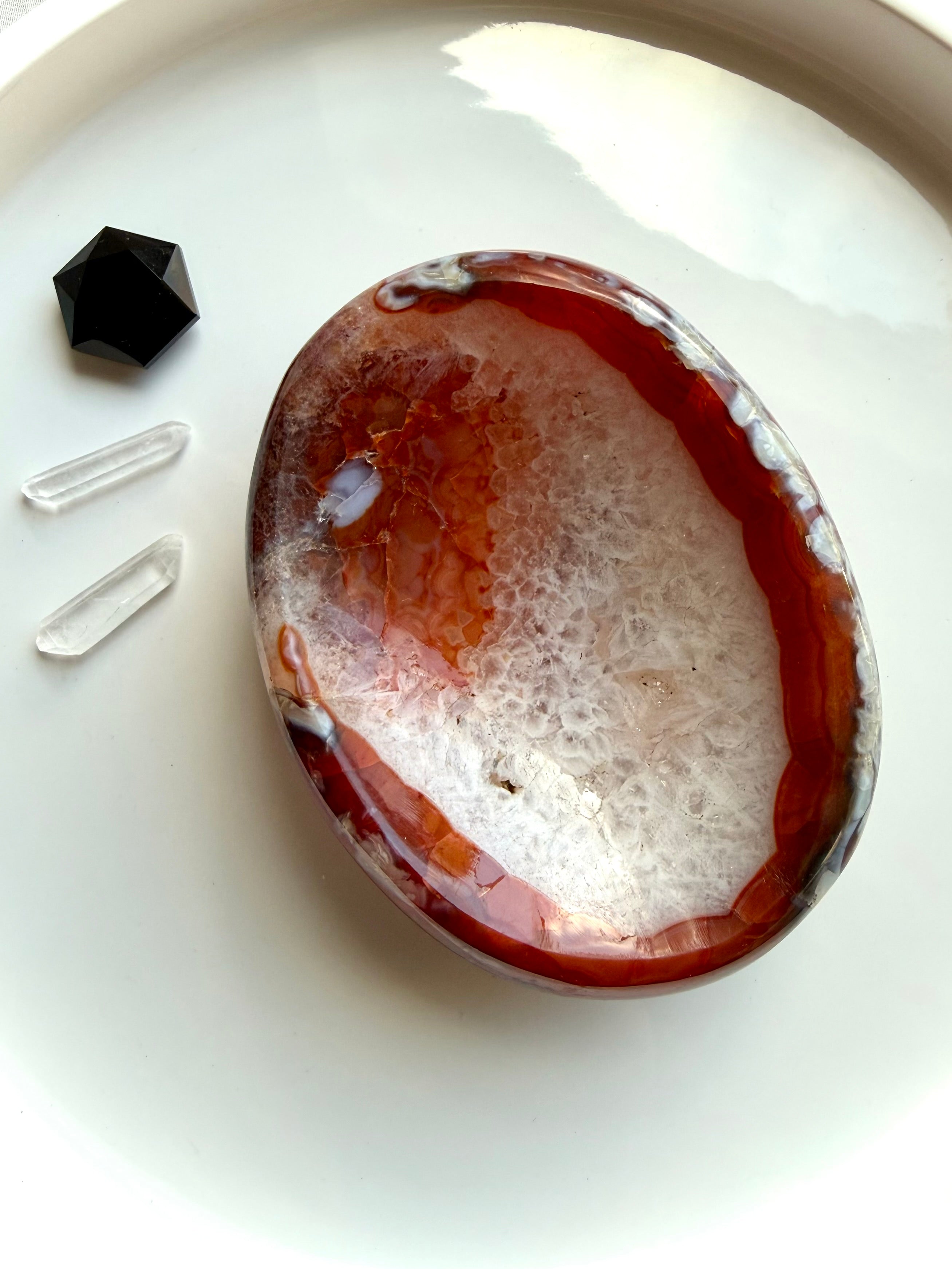 red carnelian crystal bowl with agate banding and quartz inclusions for altar decor