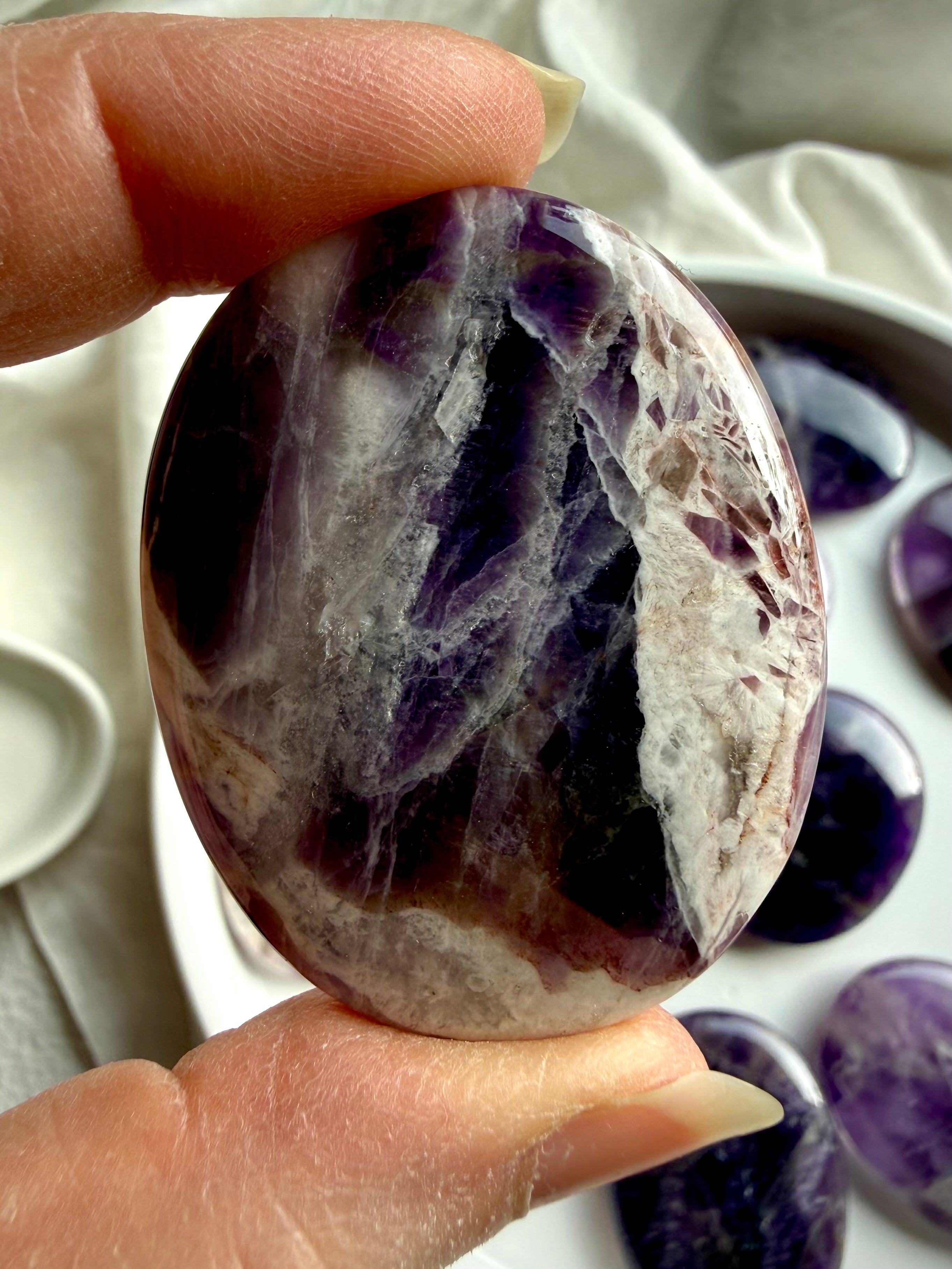 natural dream amethyst crystal palm stone with soft lavender tones
