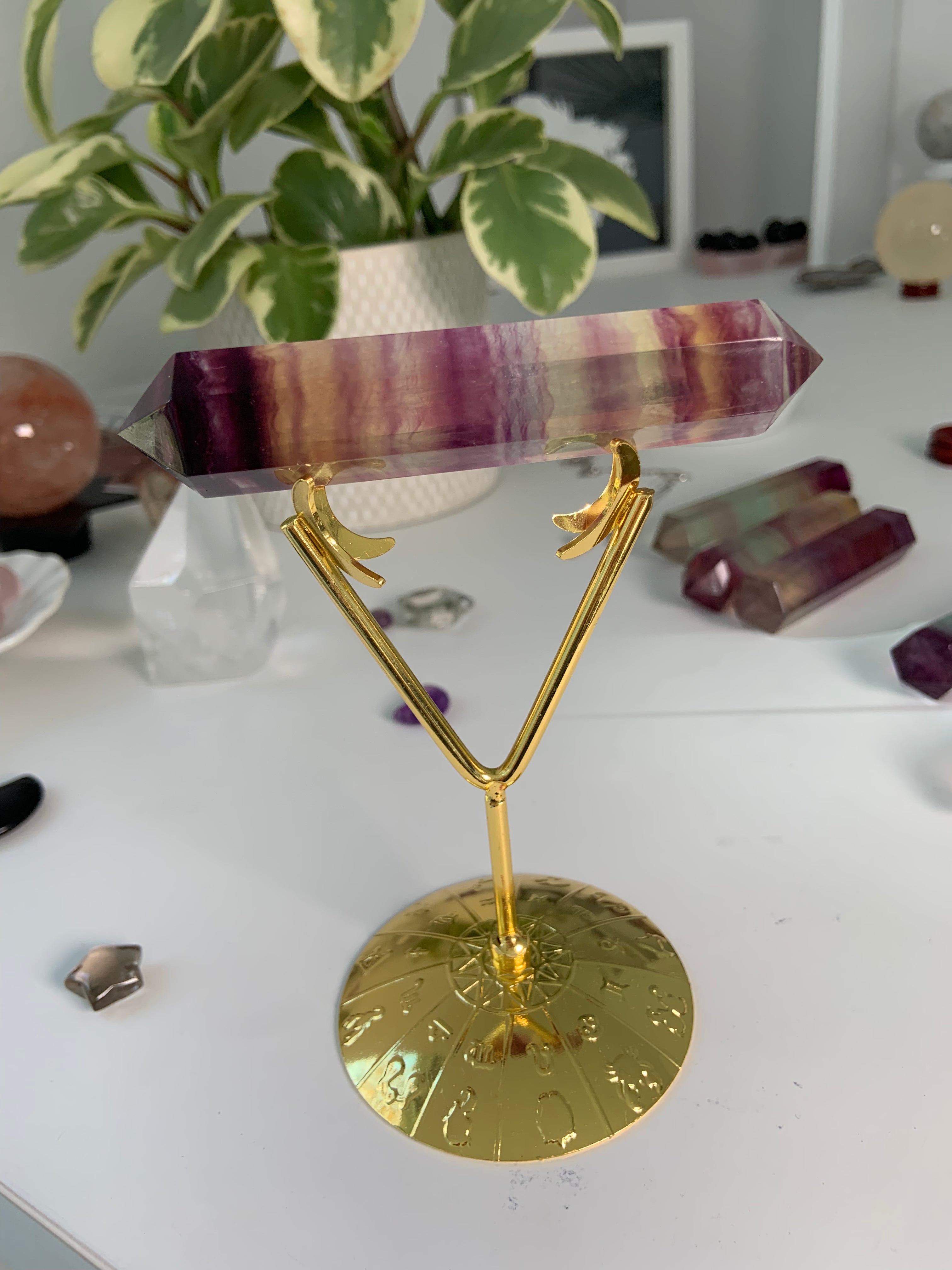 Gold crystal display stand with Fluorite double-terminated wand — versatile holder for showcasing polished specimens & crystal points.