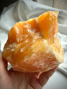 Orange Calcite display piece with dramatic white calcite banding and natural sculptural formations
