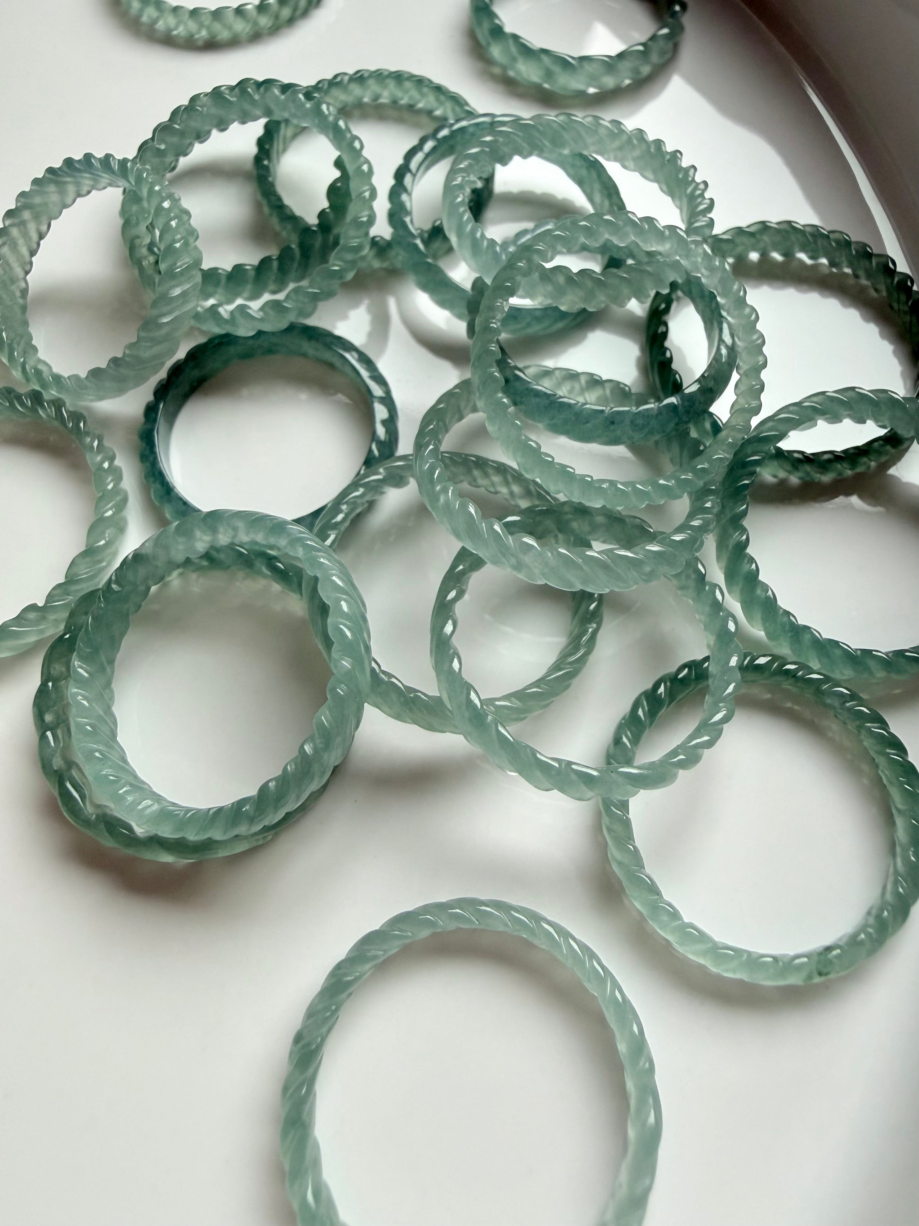 Collector-quality Blue Water Jade woven band rings with exceptional glow, premium jadeite carved in braided design