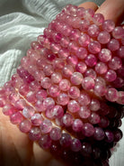 Pink Tourmaline bracelet with luminous pink gemstone beads in blush, raspberry, and berry tones for love, compassion, and Heart Chakra healing