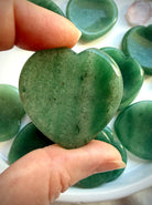 green aventurine heart worry stone showing rounded back and natural stone variation in deep green tones