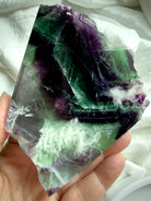 one of a kind fluorite slab with scolecite inclusions, smooth polished face, and natural crystal patterns