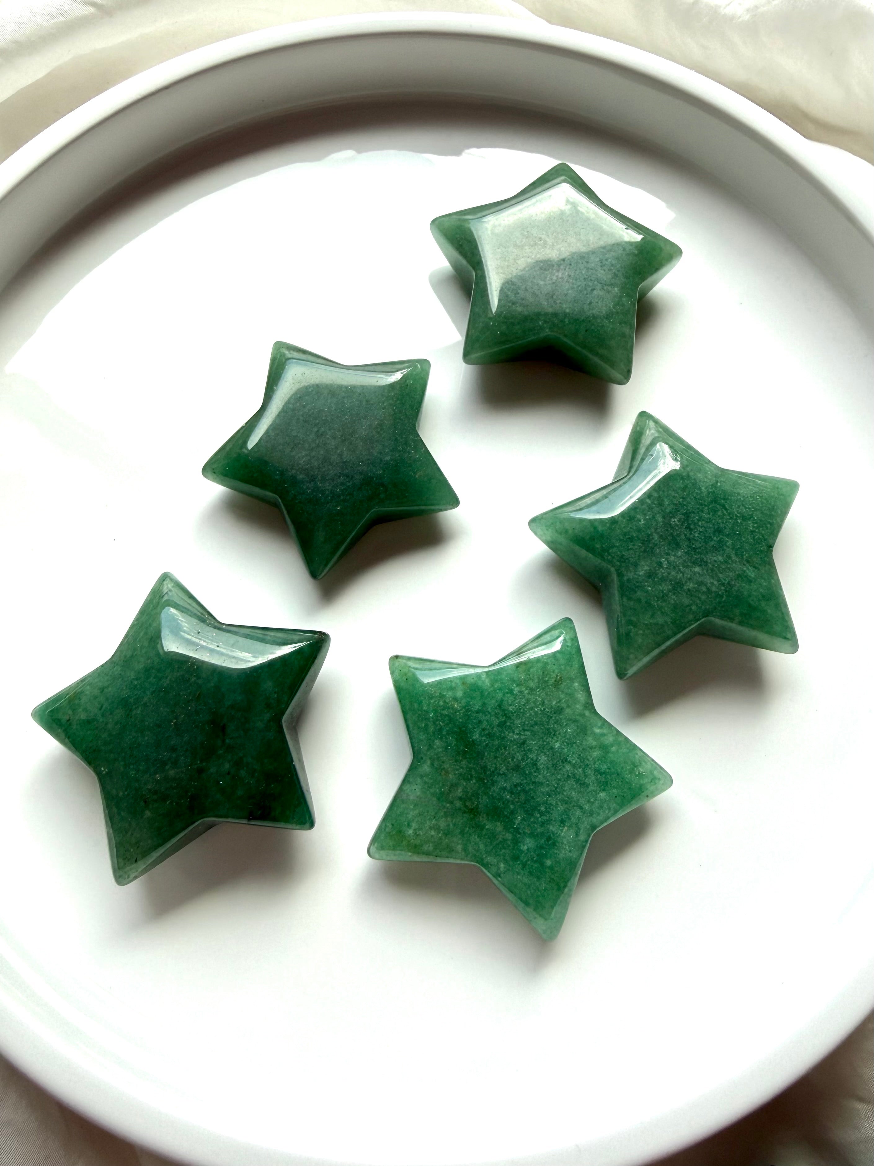 Green Aventurine stars in varied sizes with glossy polish and naturally green color, meaningful crystals for new beginnings