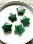 Green Aventurine stars in varied sizes with glossy polish and naturally green color, meaningful crystals for new beginnings