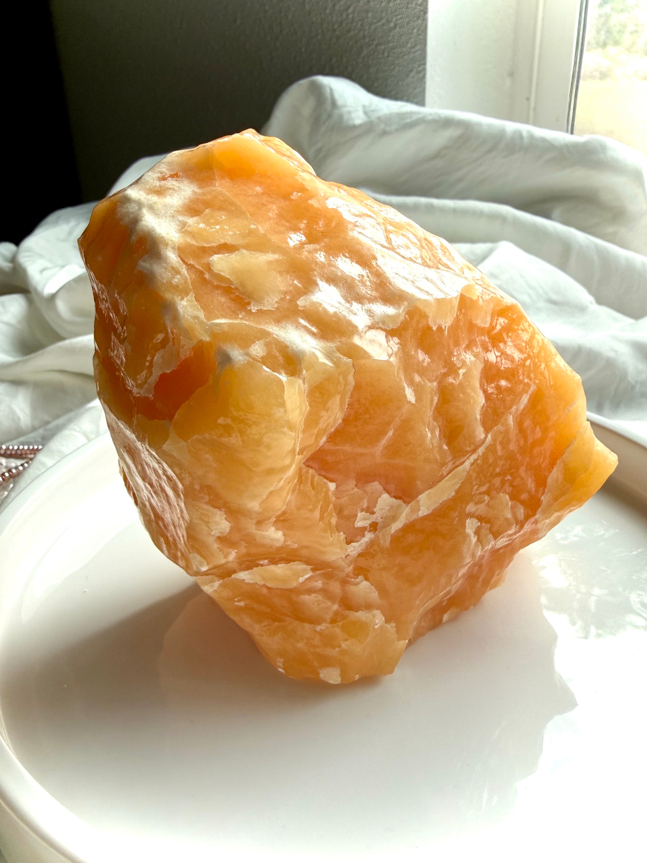 Large Orange Calcite display crystal with natural white calcite formations and sculptural mineral structure
