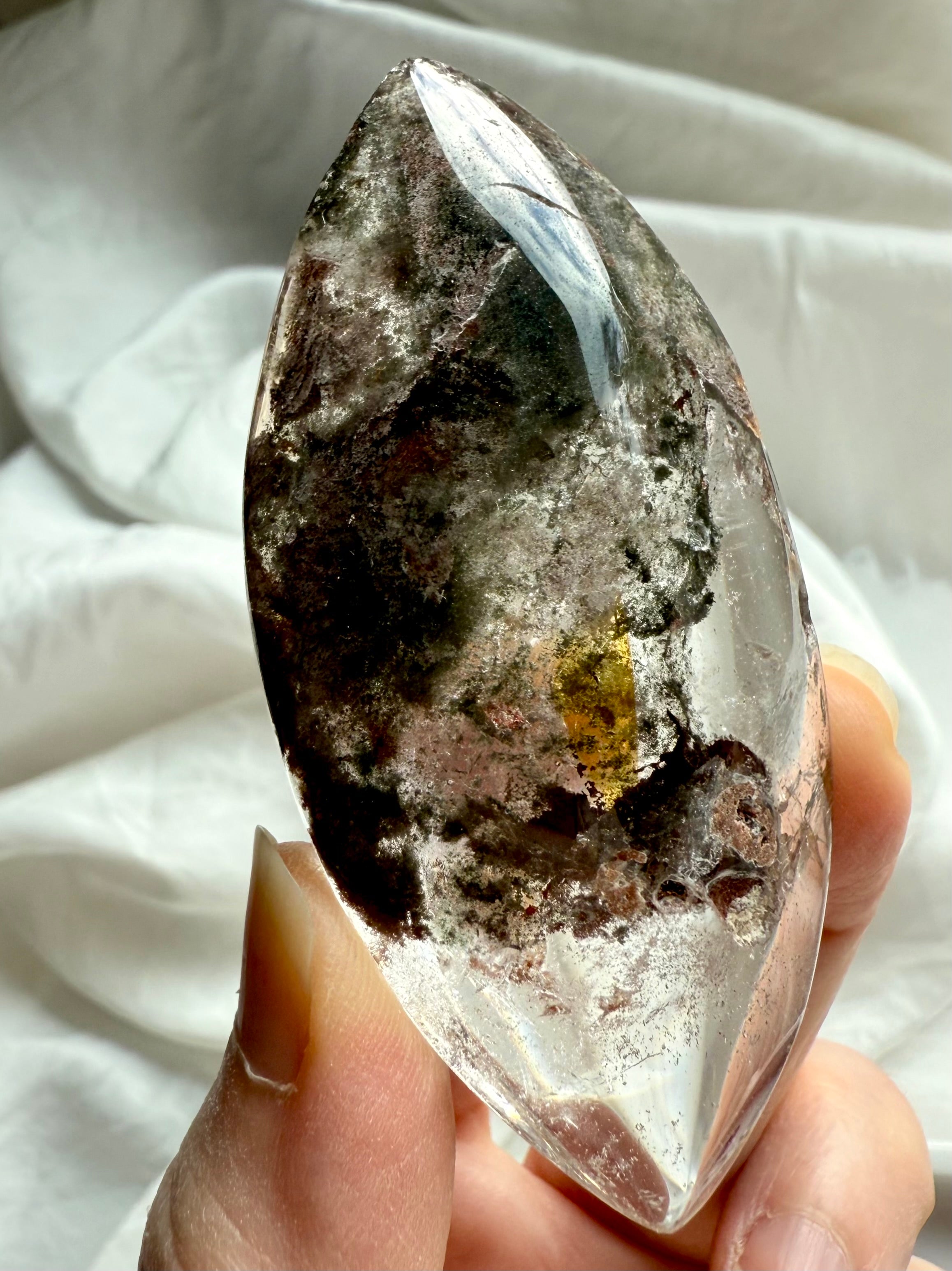 Garden Quartz marquise lens with pointed tips and visible lodolite and golden healer formations
