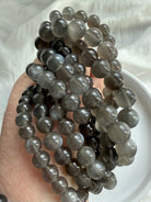 Natural Black Moonstone bracelets showing luminous adularescence and polished inky charcoal gemstone beads