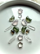 Celestial crystal grid with Smoky Quartz moons, Clear Quartz points and stars, Rose Quartz and Green Rutilated Quartz moon carvings