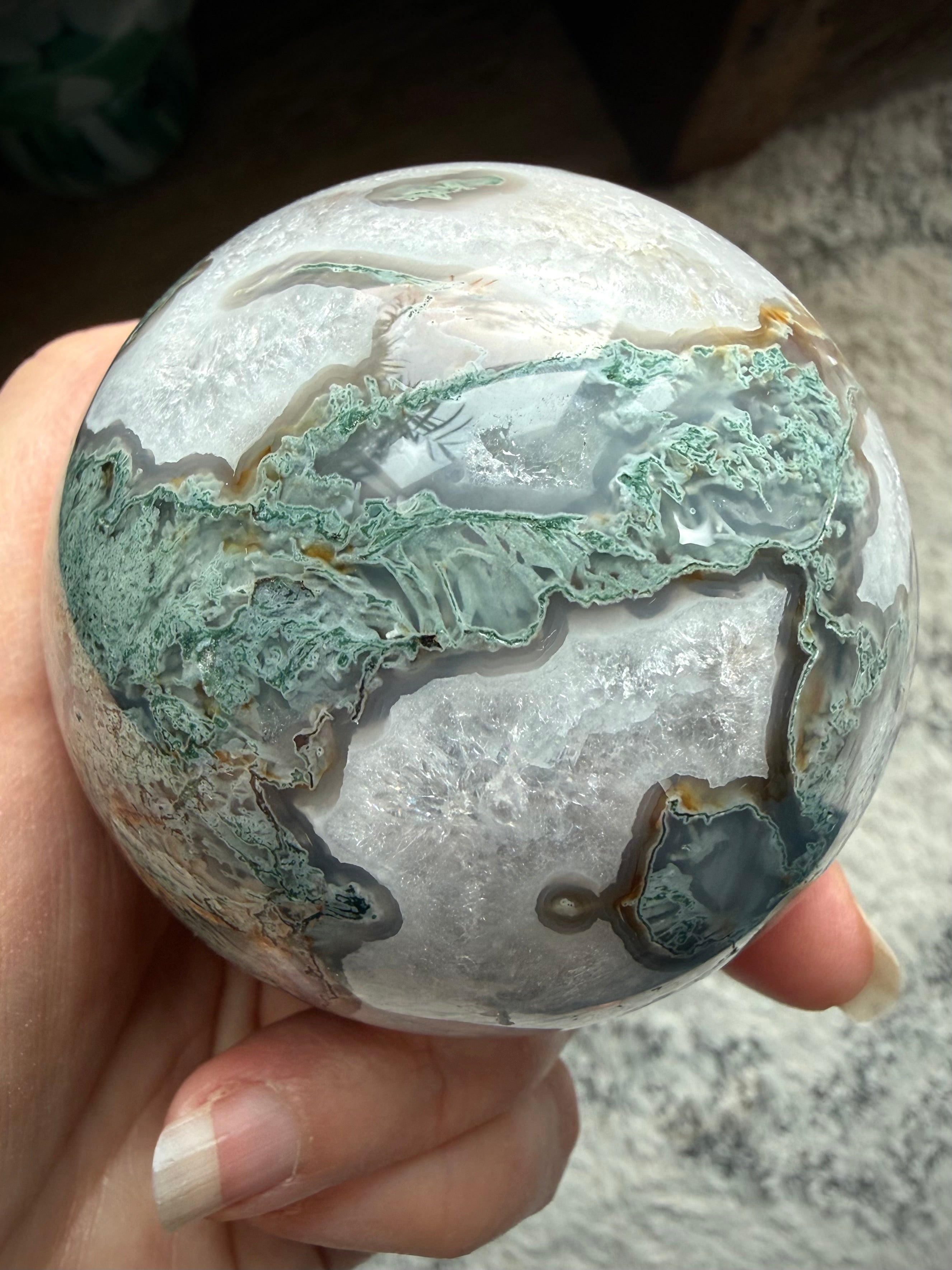Moss Agate crystal sphere with stand featuring natural druzy texture and polished crystal surface