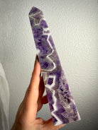Dream Amethyst tower with striking purple and white Chevron Amethyst patterns, polished crystal point for intuition and spiritual growth