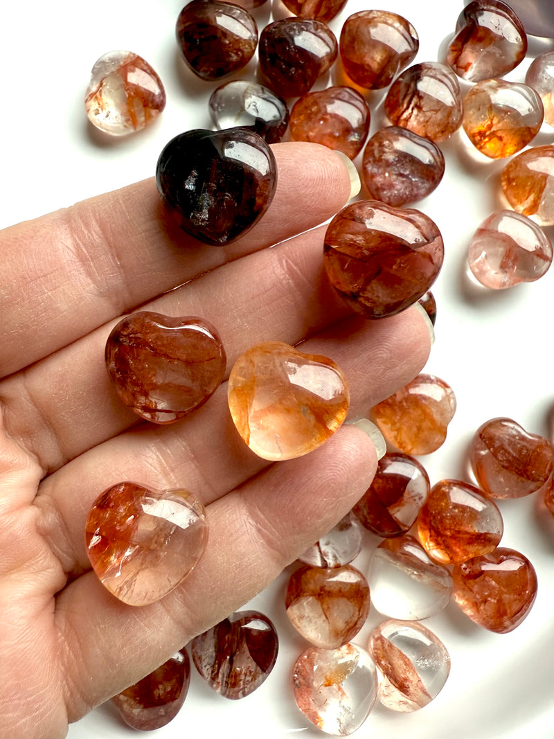 Gemmy, high quality Mini Fire Quartz Crystal Hearts shown on my hand for scale