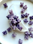 lepidolite merkaba stars shown in a selenite moon bowl, purple healing crystals for stress relief and emotional balance