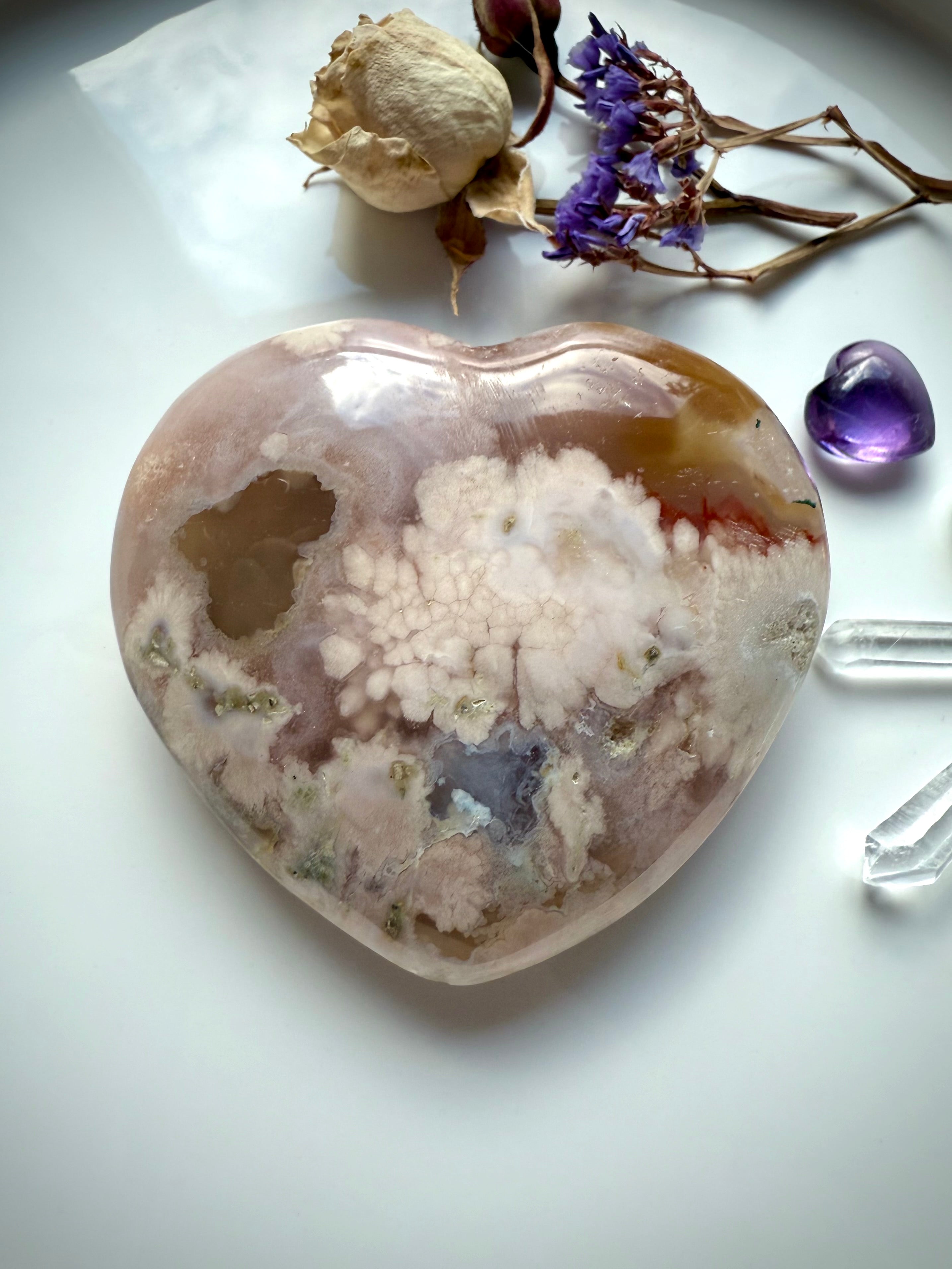 Pink Amethyst Flower Agate heart displayed with dried flowers, Amethyst mini heart, and Quartz points