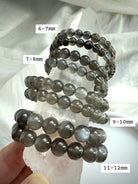 Black Moonstone bracelet size comparison displayed on Clear Quartz showing available 6–12 mm bead sizes