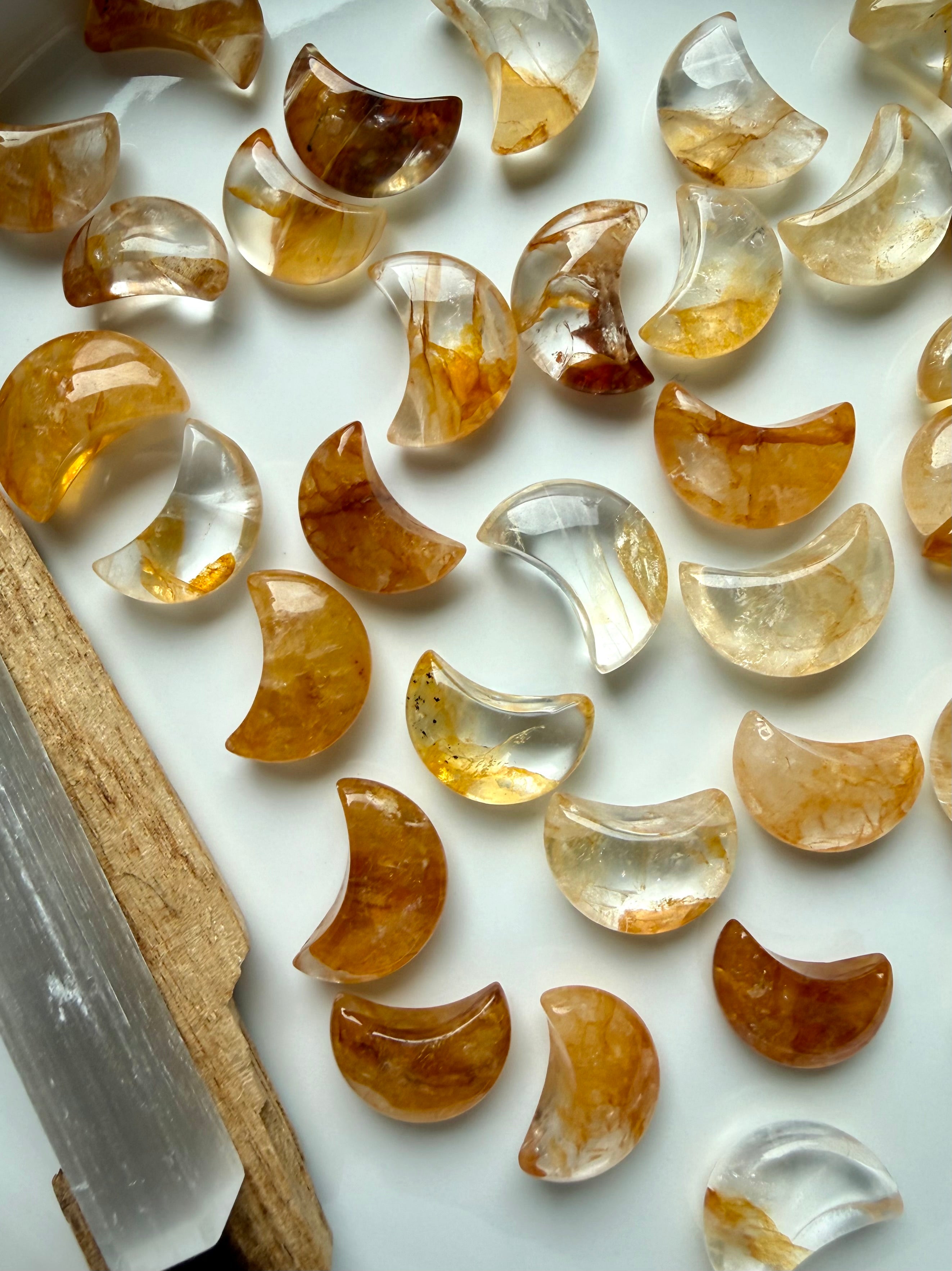 Golden Healer Quartz moon carvings with golden Hematoid inclusions for healing energy and spiritual growth