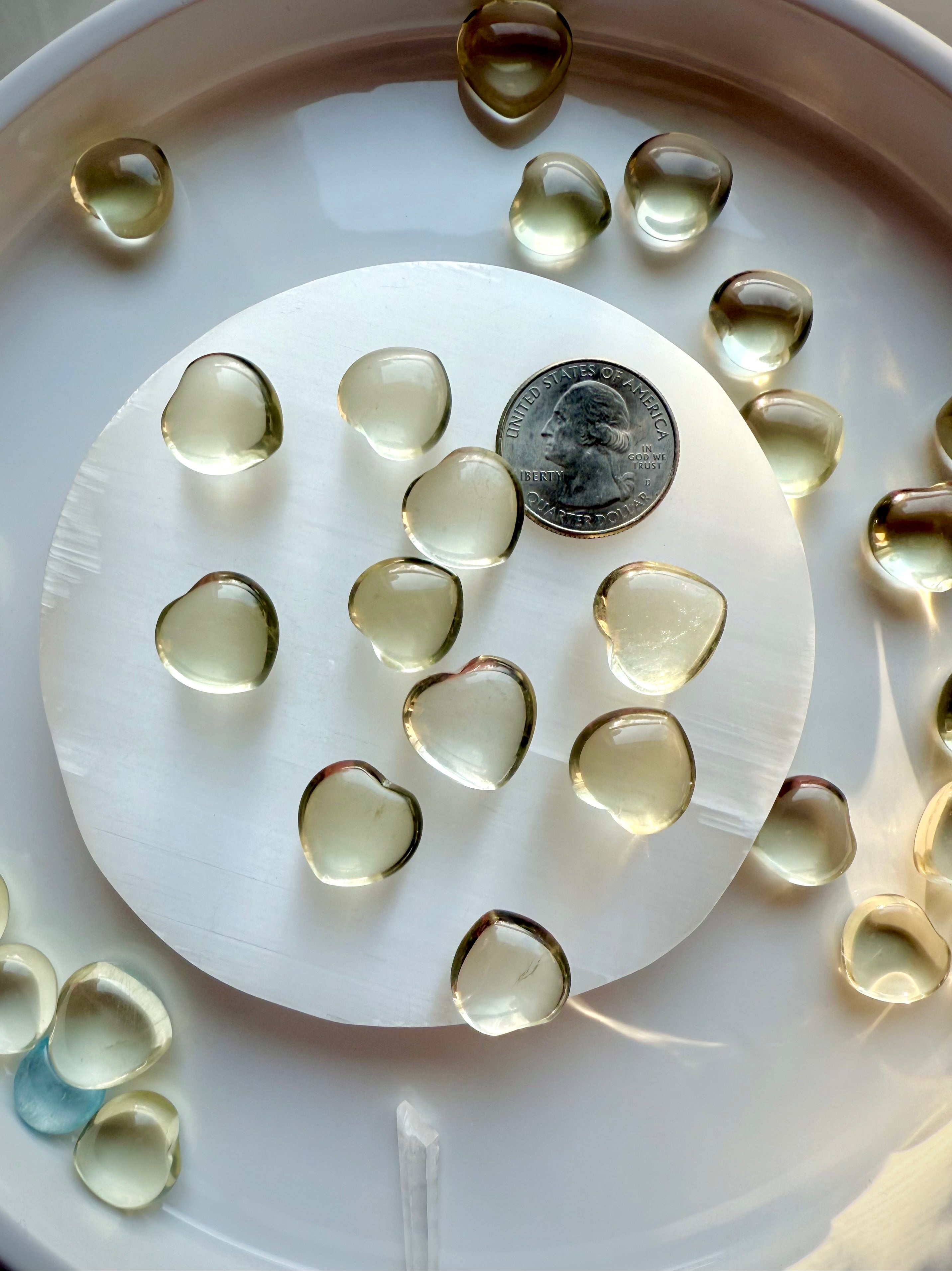 Mini Lemon Citrine heart crystal shown beside a U.S. quarter for size reference, polished yellow citrine heart for joy, confidence, and Solar Plexus Chakra healing