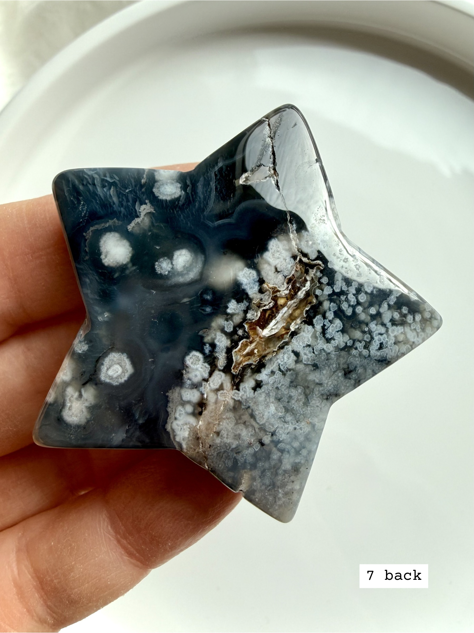 black flower agate star carving #7 back showing organic mineral inclusions and smooth polish