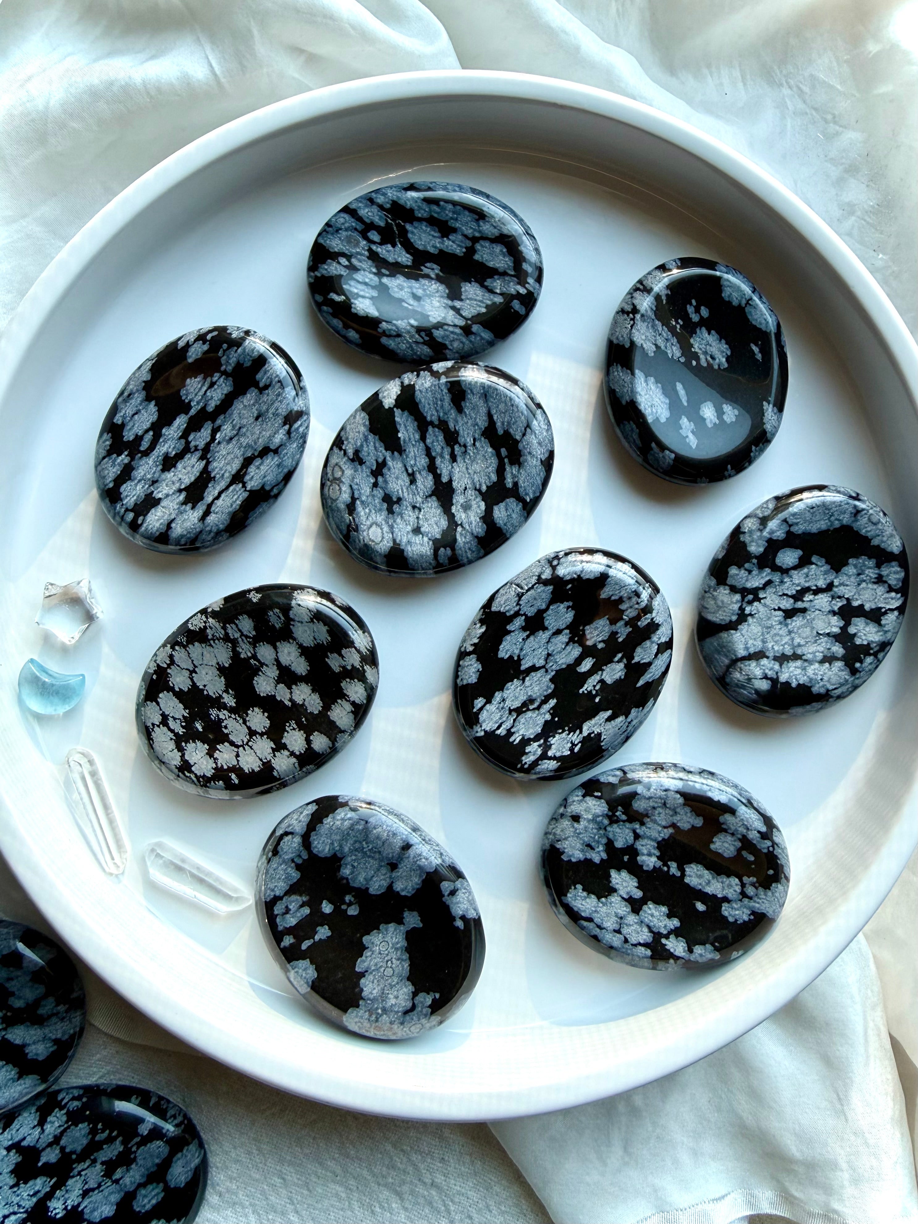 Snowflake Obsidian worry stones with natural silver snowflake patterns for grounding, calm, and protection