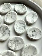 Polished Howlite worry stones with varied gray veining and soothing white color for Crown Chakra meditation