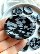 Pocket-size Snowflake Obsidian stone for grounding and emotional support